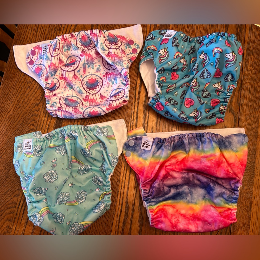 Colorful Kids Cloth Diaper Cover Set/4. (Value of 31 on website)Like new. Easy !